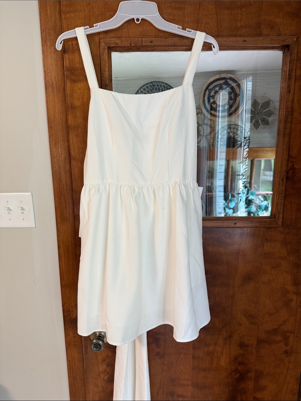 White Sleeveless Square-Neck Mini Dress with a bow in the back